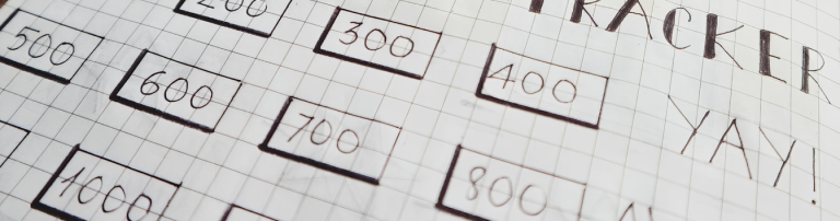 Hand-drawn progress tracker on grid paper with numbered boxes.