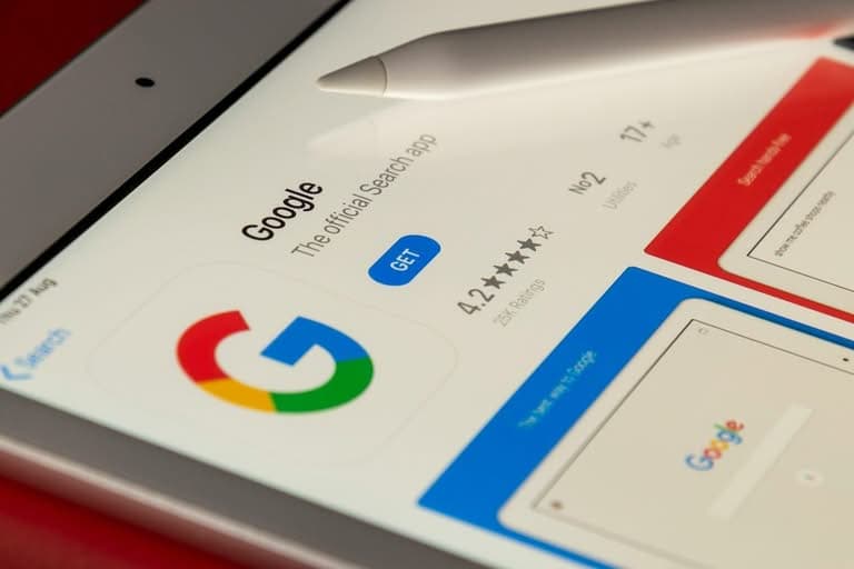 Google app on a tablet screen with a stylus.