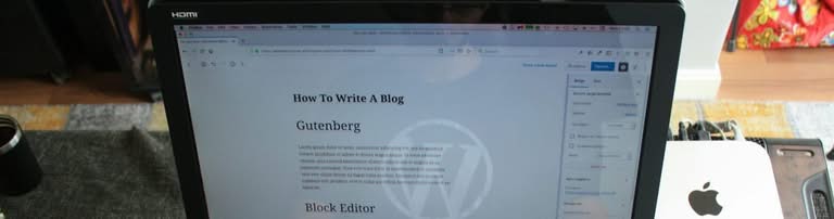 Close-up of a laptop screen displaying a WordPress editor.