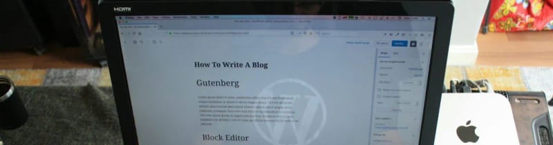 Close-up of a laptop screen displaying a WordPress editor.